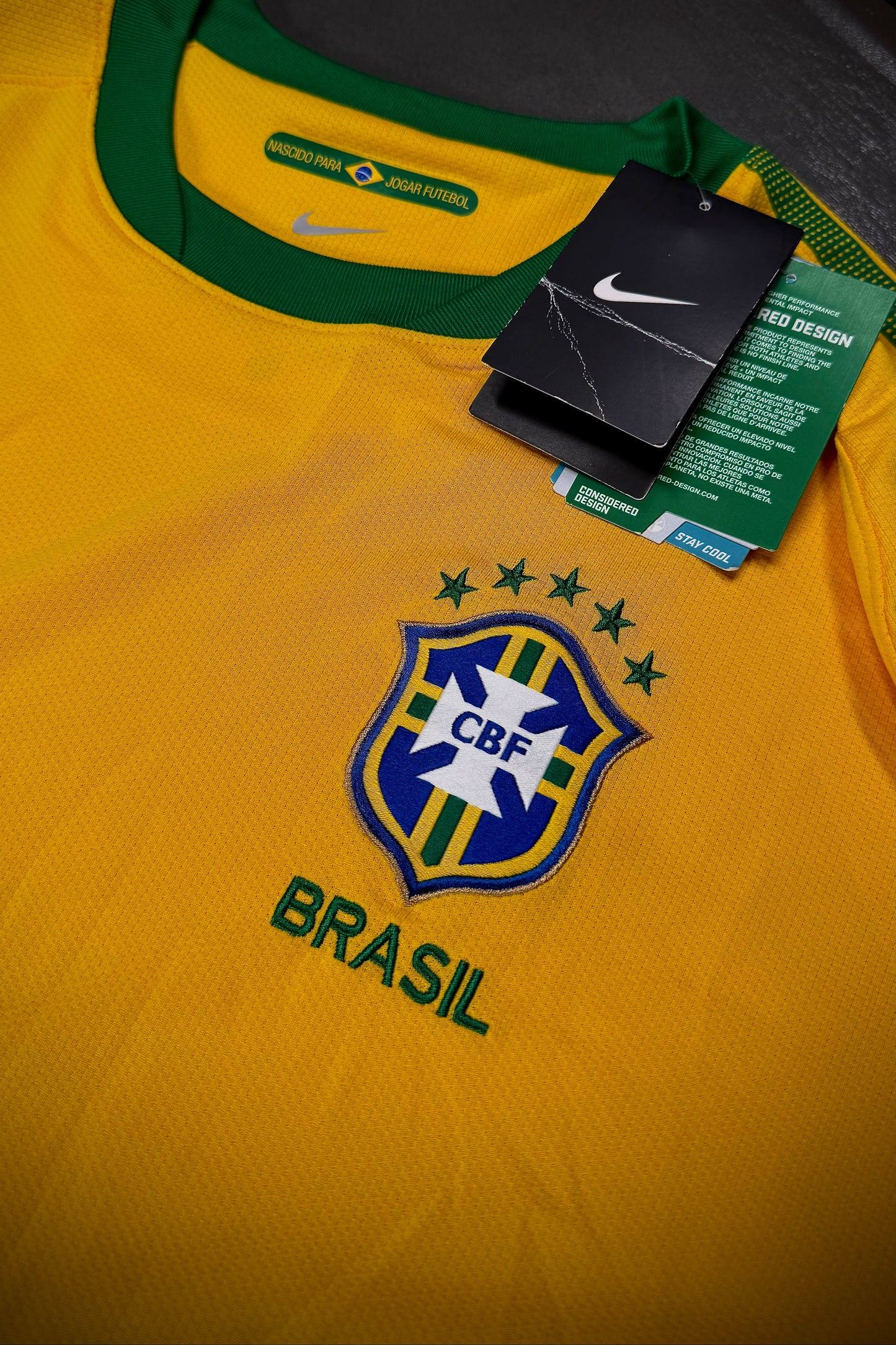 Yellow sports jersey with green collar and Nike branding, featuring the CBF logo.