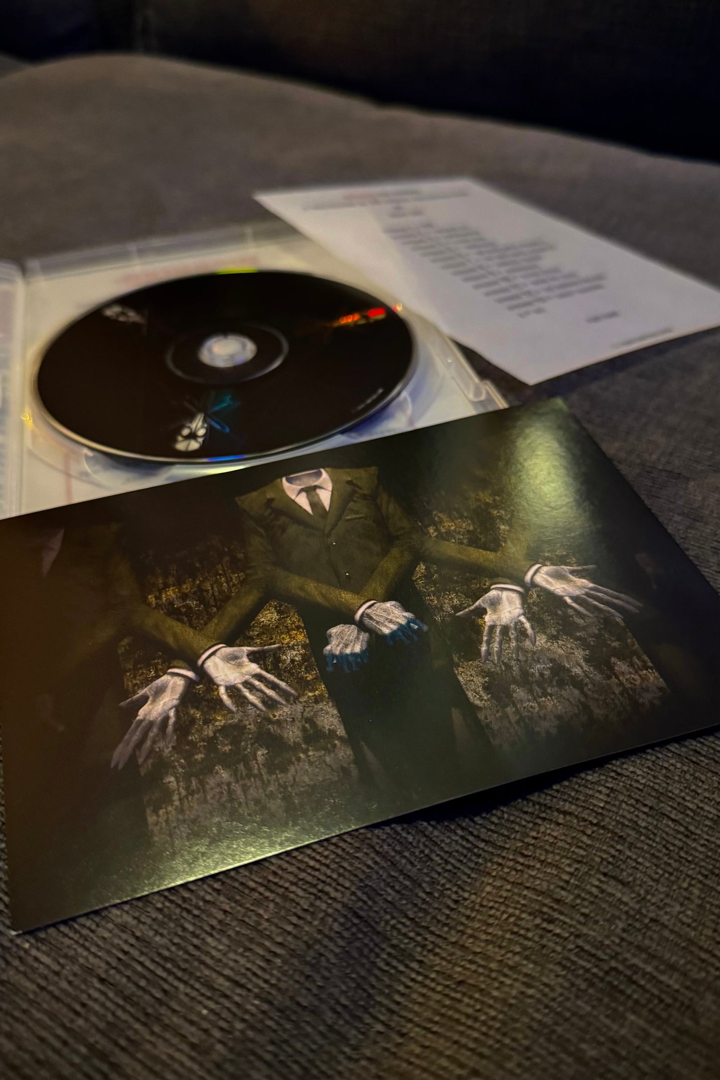 CD and cover on a textured surface