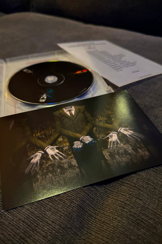 CD and cover on a textured surface