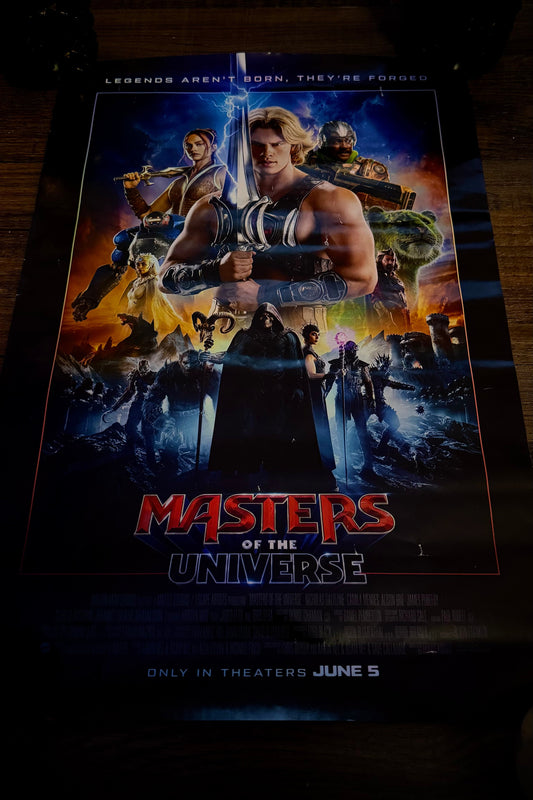 Movie poster for 'Masters of the Universe' with characters and text.